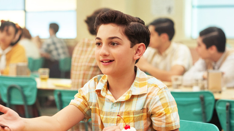 Arian S. Cartaya's Rich Santos sits at a lunch table at Derry High School in It Welcome to Derry