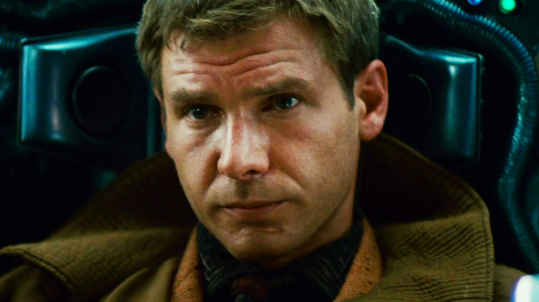 Harrison Ford's Rick Deckard sits in a cockpit in Blade Runner