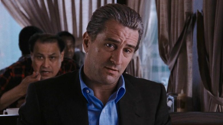 De Niro's Jimmy Conway speaks to Ray Liotta's Henry inside a diner in Goodfellas