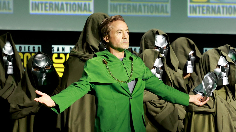 Robert Downey Jr. in costume as Doctor Doom at SDCC on stage with people in Doom costumes