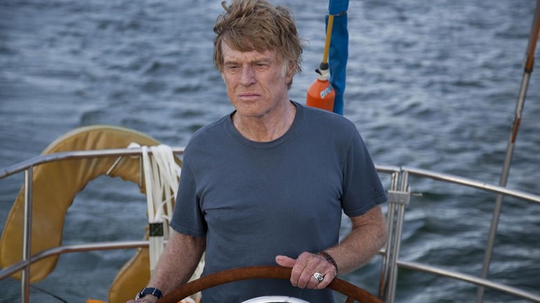 Robert Redford as 'Our Man' steering a boat in All Is Lost