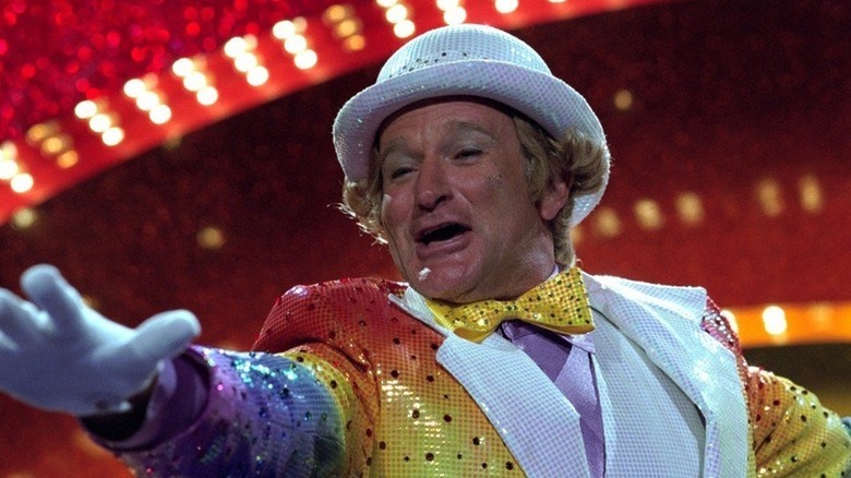 Rainbow Randolph (Robin Williams) performs in costume on stage in Death to Smoochy