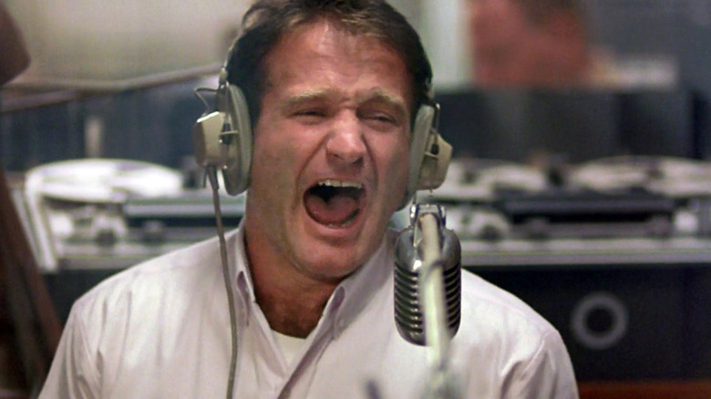Adrian Cronauer (Robin Williams) shouts into his mic in Good Morning, Vietnam