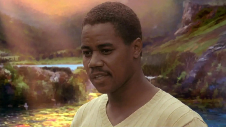 "Albert Lewis" against a painterly landscape in What Dreams May Come