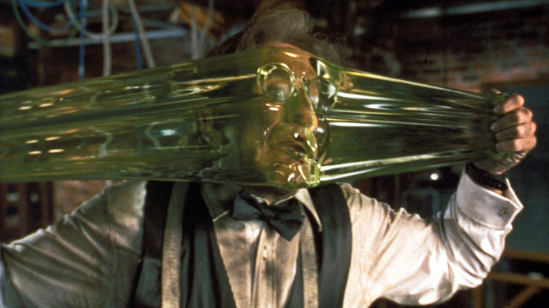 Robin Williams as Philip Brainard stretching Flubber across his face in Flubber