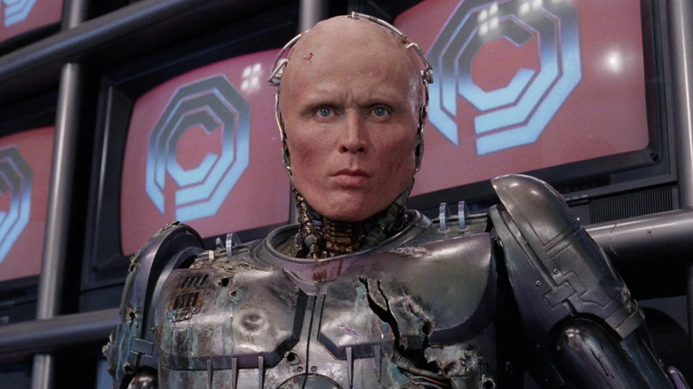 RoboCop, sans his helmet, in the OCP offices in RoboCop (1987)