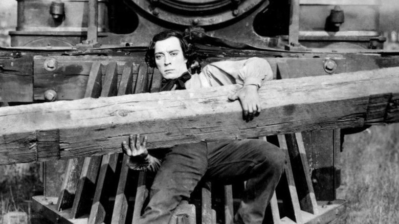 Buster Keaton as Johnnie Gray is stuck to a cowcatcher of a locomotive in The General