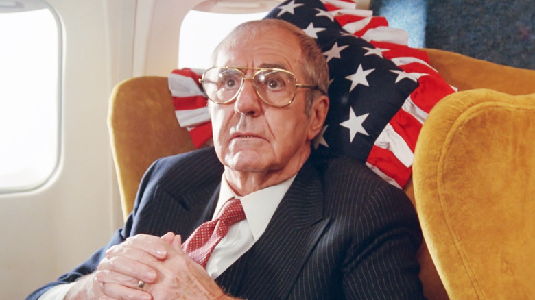 Jim Backus' President of the United States sits in a chair on Air Force One in Slapstick of Another Kind