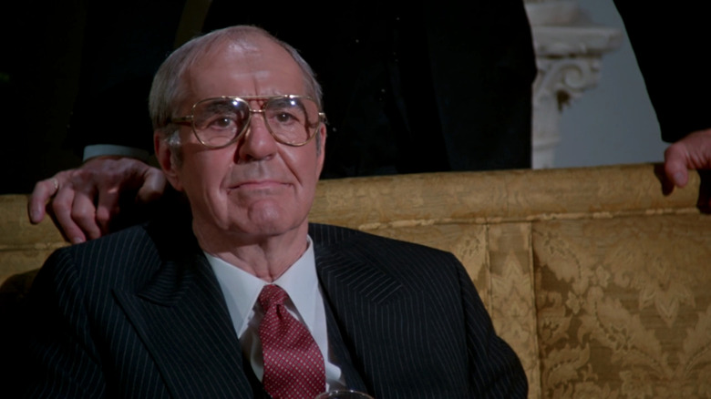 Jim Backus' President of the United States sits on a couch in Slapstick of Another Kind