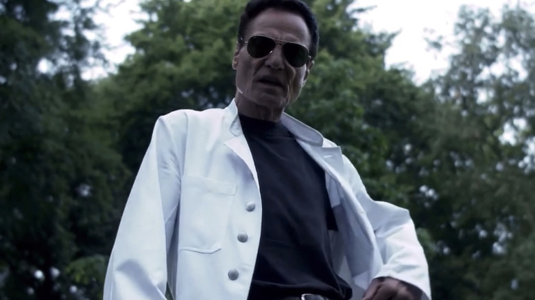 Dieter Laser's Josef Heiter looks down as he stands outside in The Human Centipede First Sequence