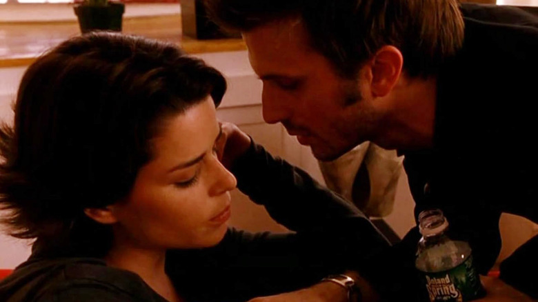 Neve Campbell's Vera Barrie looks down next to Frederick Weller as Ford Welles in When Will I Be Loved