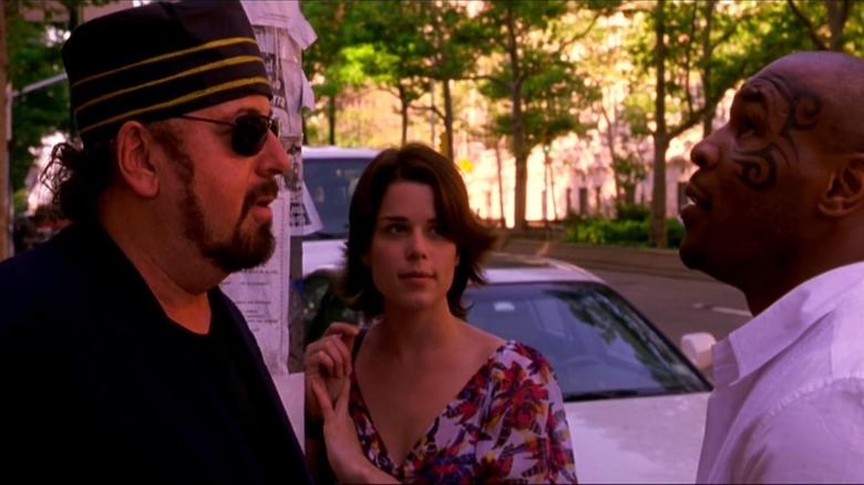 James Toback as Professor Hassan Al-Ibrahim Ben Rabinowitz speaks with Mike Tyson as Neve Campbell's Vera Barrie watches in When Will I Be Loved
