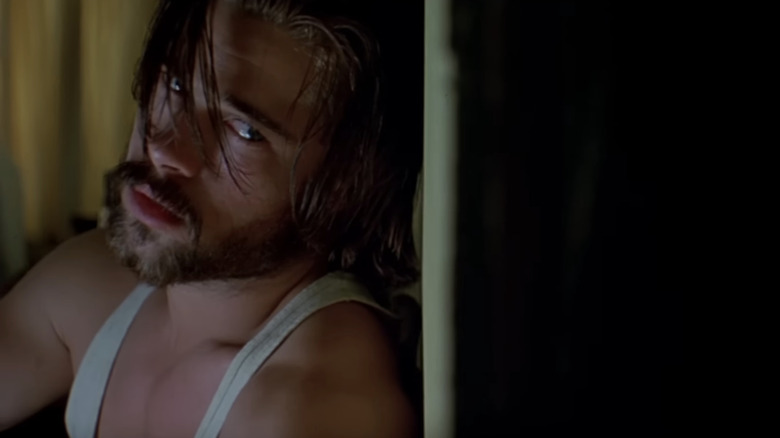 Brad Pitt's Early Grace looks ominous as he leans against a wall in Kalifornia