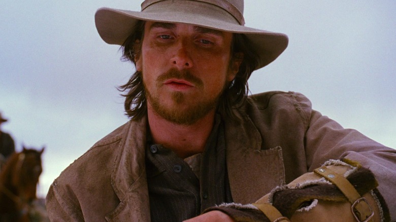 Christian Bale as Dan Evans wearing a cowboy hat in 3:10 to Yuma