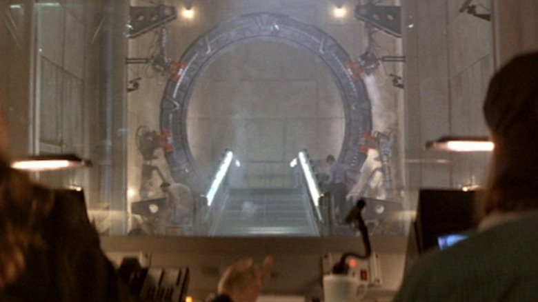 The Stargate portral is seen  between two workers in Stargate