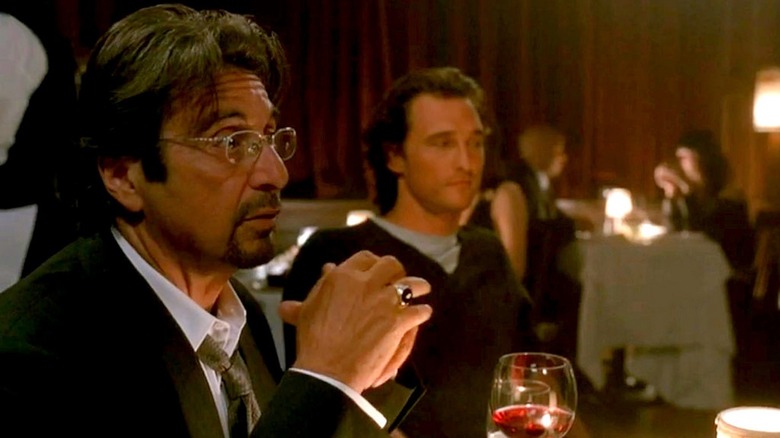 Al Pacino enjoys a glass of wine as Walter Abrams while Matthew McConaughey sits in the background as Brandon Lang in Two for the Money