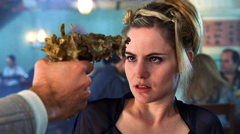 Allegra Gellar with a bon gun pointed at her forehead in eXistenZ