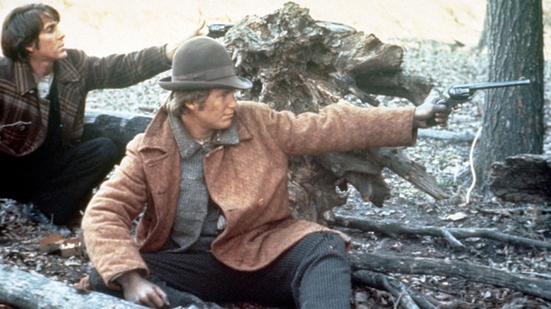 Jeff Bridges as Jake Rumsey and Barry Brown as Drew Dixon return fire in Bad Company