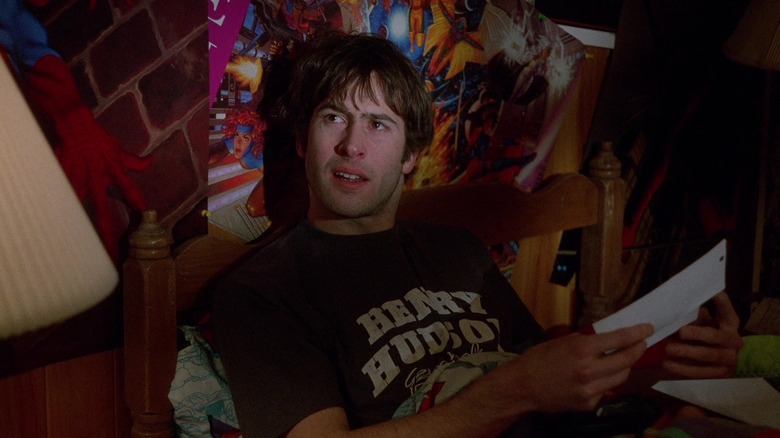 Brodie reading a letter in his messy room in Mallrats