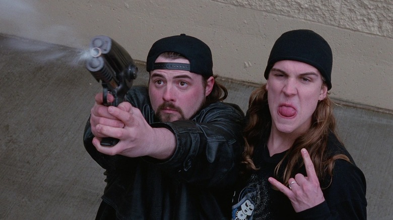 Silent Bob firing a grappling hook with Jay throwing horns at Mallrats