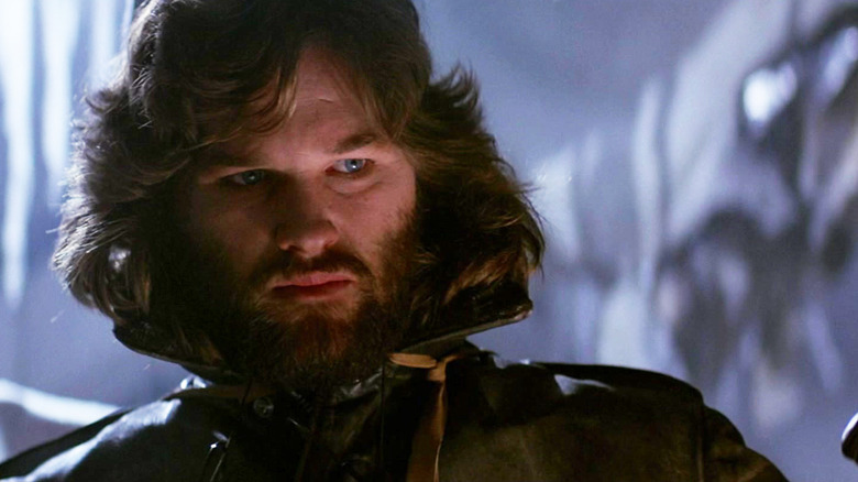 Kurt Russell's R. J. MacReady stands in shadow in The Thing