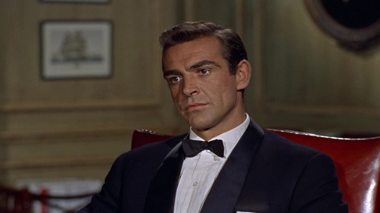 Sean Connery's James Bond sits in M's office wearing a tuxedo in Dr No