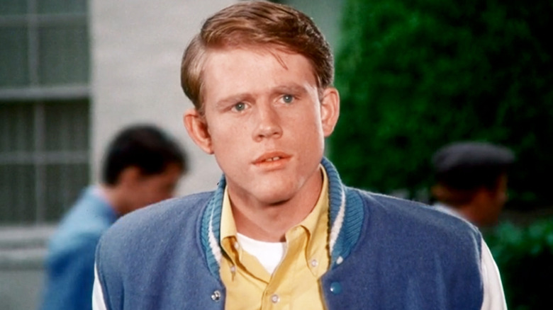Ron Howard's Richie Cunningham stands outside his school in Happy Days