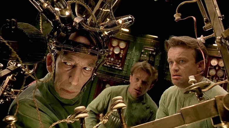 Krank looking around with two clones next to him in The City of Lost Children