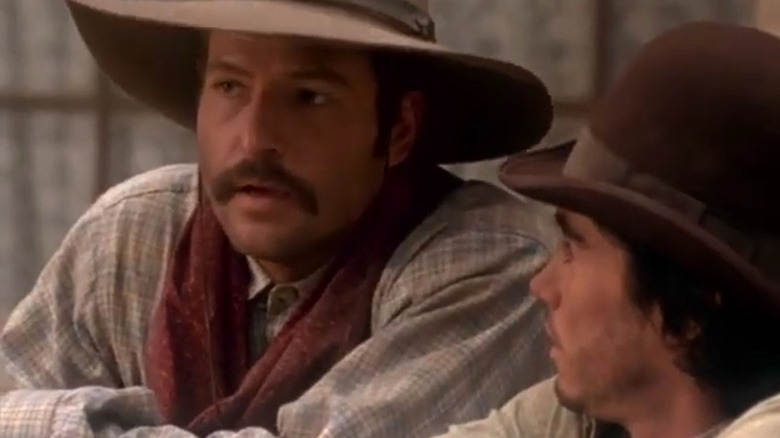 Buck Wilmington talking to a younger cowboy in The Magificent Seven TV series