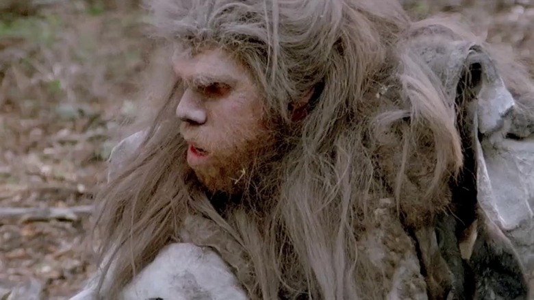 Ron Perlman as Amoukar sitting still in Quest for Fire