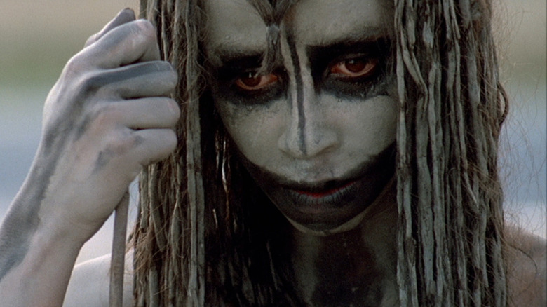 Rae Dawn Chong as Ika looking downward in Quest for Fire