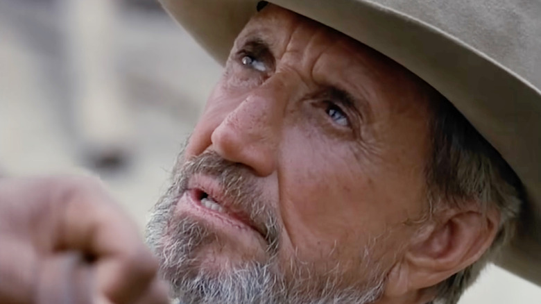 Henry Westover wearing a cowboy hat and blue neckerchief in King of Texas