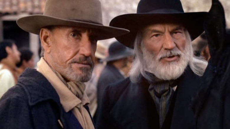 Henry Westover and John Lear in a crowded street in King of Texas