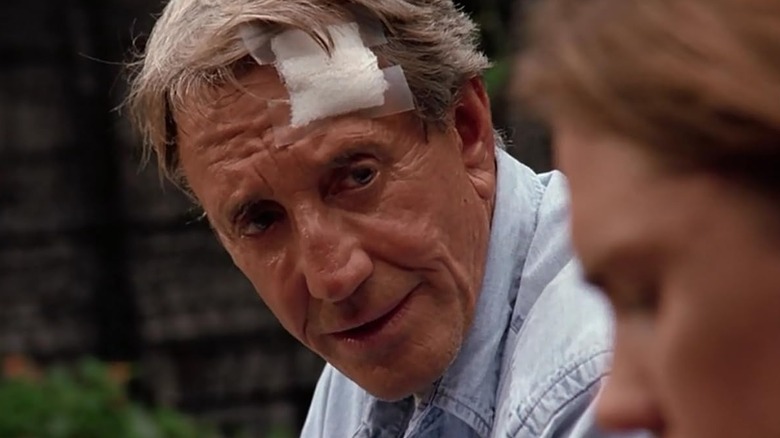 Roy Scheider as Captain Nathan Bridger (with a bandage on his head) looking at Jonathan Brandis as Lucas Wolenczak in seaQuest DSV