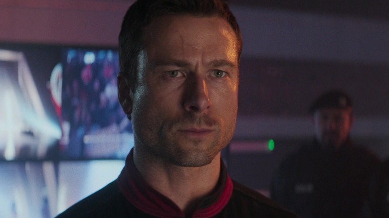 Glen Powell's Ben Richards looks upset in closeup in The Running Man
