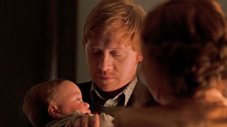 Rupert Grint Servant cradling baby