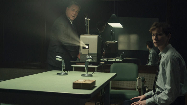 Henry Murray working a projector while Ted Kaczynski watches in Unabomber