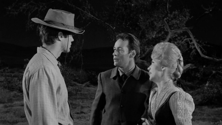 Russell Johnson's Burt Harvey and Ruta Lee's Lorraine Stanton look at Clint Eastwood's Rowdy Yates in Rawhide