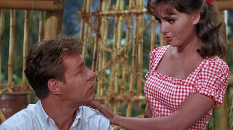 The professor being comforted by Mary Ann on the island of Gilligan