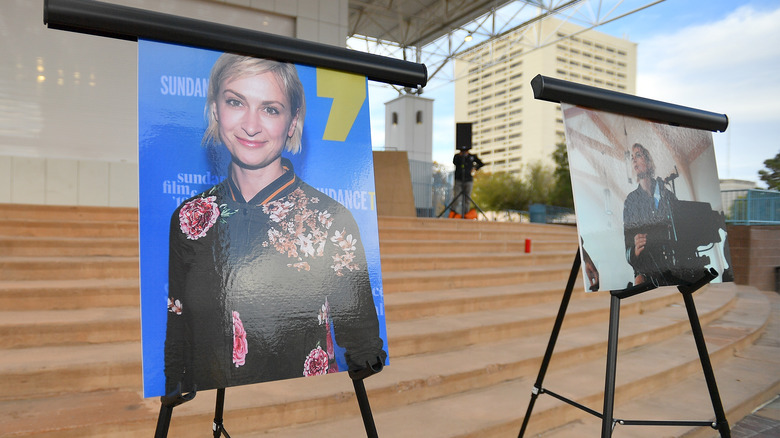 Photos of Halyna Hutchins sit at a memorial service for the late cinematographer, the victim of an accidental shooting on the set of western film Rust