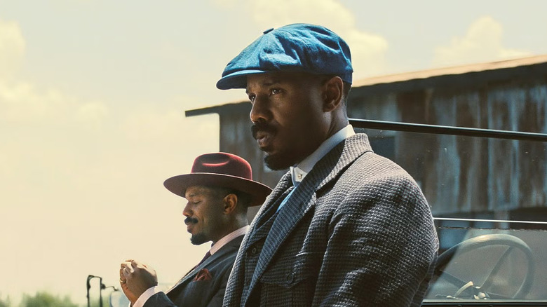 Stack and Smoke leaning against their car in Sinners