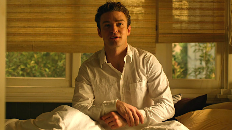 Justin Timberlake sitting in bed in The Social Network