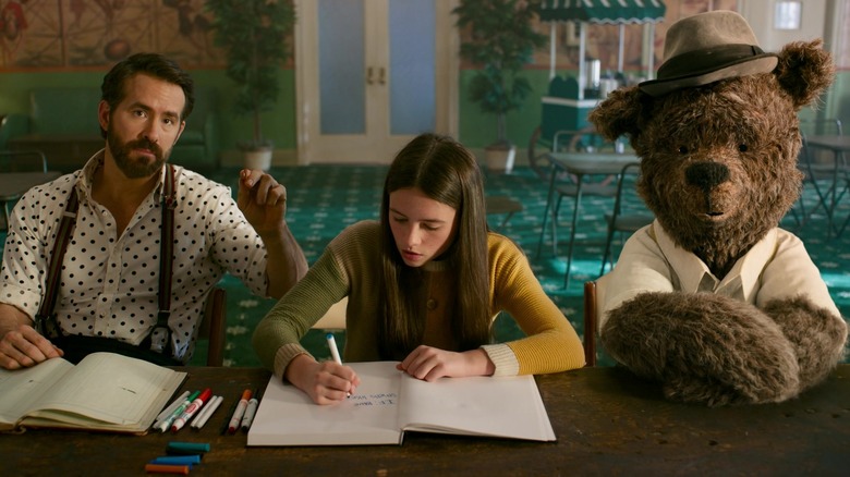 Cal, Bea, and Lewis at a table in IF