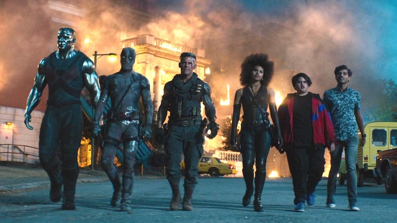 Deadpool walking with Colossus, Cable, Domino, Firefist, and Dopinder walking away at the end of Deadpool 2