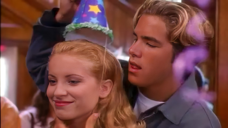 Seth stands behind Katie in the charming teenager Sabrina