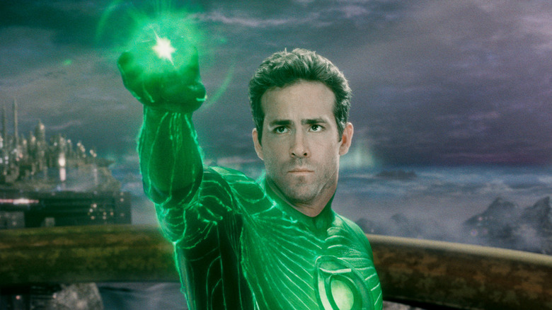 Ryan Reynolds as Hal Jordan holding up the Power Ring in Green Lantern