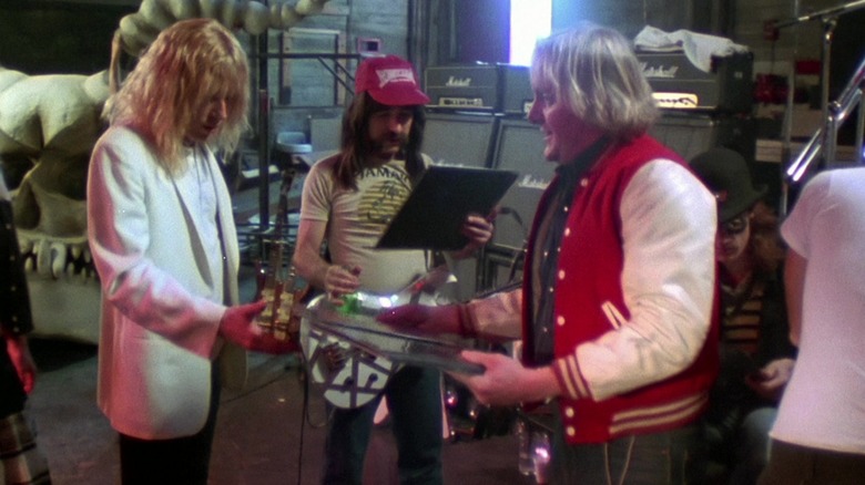 Derek Smalls and David St. Hubbins and their manager looking at all black records in This Is Spinal Tap