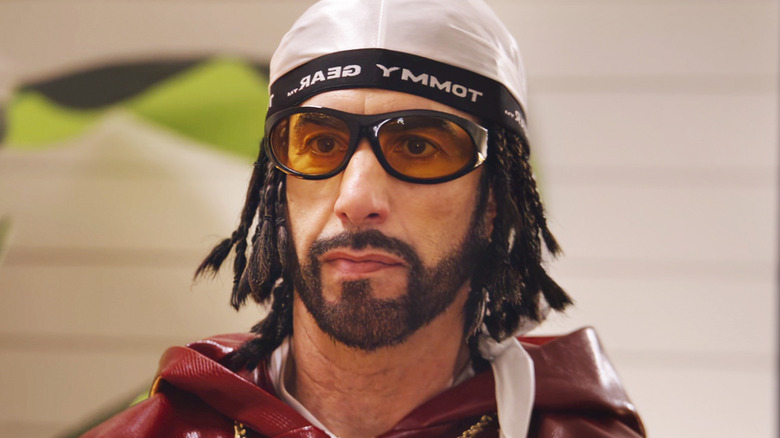 Sacha Baron Cohen's Ali G is seen in closeup as he sits in a doctor's office in Ali G Who Iz I?