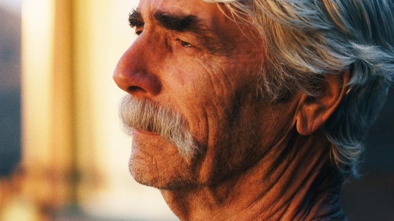 Sam Elliott's Lee Hayden looks somber as he gazes off into the distance in The Hero