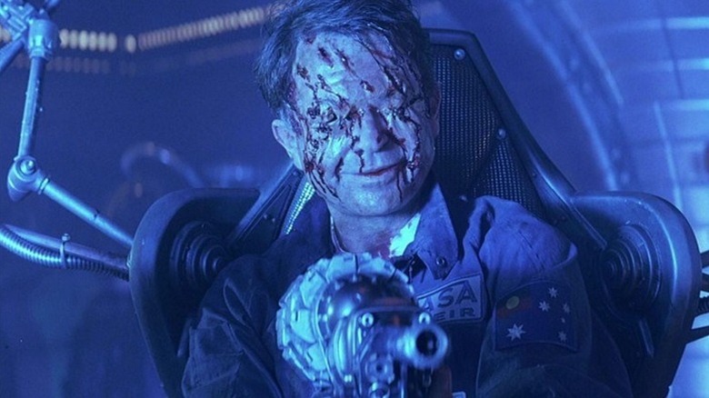 A mauled and really messed up Weir smiling in Event Horizon